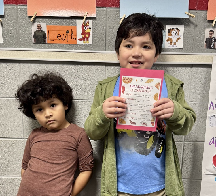 A student holding the Blessing Poem 