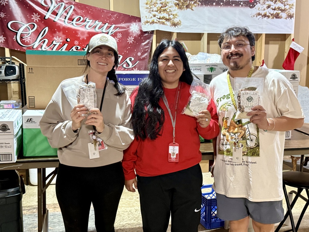 two teachers dropping off Bean Soup packets at Greater Works
