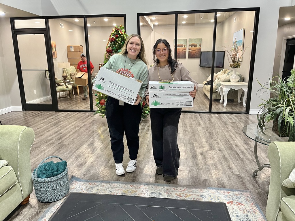 two teachers dropping off Bean Soup packets at City of Refuge