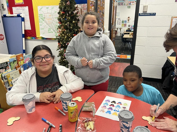 Students making ornaments with their buddies