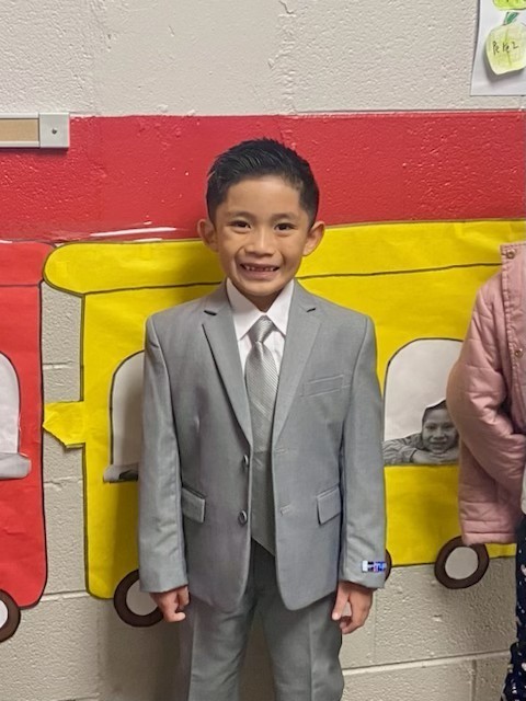 Young boy smiling at the camera 