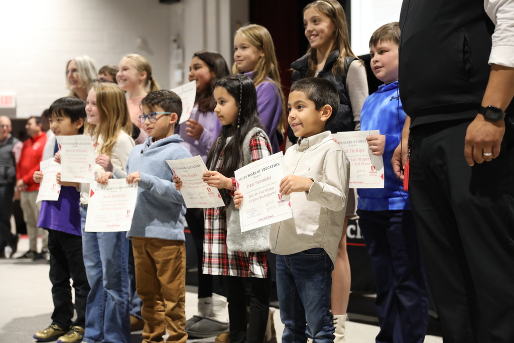 During the December 8 Board of Education meeting, the Dalton Board of Education celebrated outstanding student achievements and athletic excellence across the district. The Board recognized the Dalton High School Varsity Volleyball Team for qualifying for the state playoffs; the Hammond Creek Middle School / Dalton Junior High School Boys Golf Team for earning the title of BGMSAA Region Champions; and the HCMS/DJHS JV Volleyball Team, the HCMS/DJHS Boys Cross Country Team, and the HCMS/DJHS Girls Cross Country Team for finishing as BGMSAA Region Runner-Up in their respective sports. The Board also honored the Dalton High School Cross Country Team for being named NGXCL League Champions, with one athlete placing 8th at Region. In addition, the Board recognized the Hammond Creek Middle School 6th Grade Football Team and the Dalton Junior High School 8th Grade Football Team for finishing as State Finalists, and celebrated the Hammond Creek Middle School 7th Grade Football Team for becoming State Champions. The Dalton High School Football Team was recognized as a State Playoffs Qualifier. The Dalton High School One Act Competition Team was also honored for earning the Best Set Award and placing 4th Overall. The Board further recognized students featured in the Hartsfield–Jackson Atlanta International Airport Youth Art Gallery – World Cup Edition, as well as the talented artists named as 2025 District Art Fair Winners. The Board congratulates all students, teams, and artists for their remarkable accomplishments and their commitment to excellence in Dalton Public Schools.