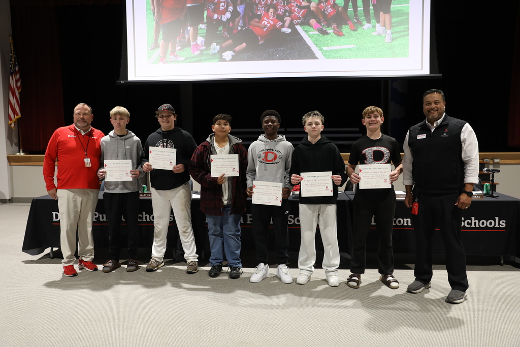 During the December 8 Board of Education meeting, the Dalton Board of Education celebrated outstanding student achievements and athletic excellence across the district. The Board recognized the Dalton High School Varsity Volleyball Team for qualifying for the state playoffs; the Hammond Creek Middle School / Dalton Junior High School Boys Golf Team for earning the title of BGMSAA Region Champions; and the HCMS/DJHS JV Volleyball Team, the HCMS/DJHS Boys Cross Country Team, and the HCMS/DJHS Girls Cross Country Team for finishing as BGMSAA Region Runner-Up in their respective sports. The Board also honored the Dalton High School Cross Country Team for being named NGXCL League Champions, with one athlete placing 8th at Region. In addition, the Board recognized the Hammond Creek Middle School 6th Grade Football Team and the Dalton Junior High School 8th Grade Football Team for finishing as State Finalists, and celebrated the Hammond Creek Middle School 7th Grade Football Team for becoming State Champions. The Dalton High School Football Team was recognized as a State Playoffs Qualifier. The Dalton High School One Act Competition Team was also honored for earning the Best Set Award and placing 4th Overall. The Board further recognized students featured in the Hartsfield–Jackson Atlanta International Airport Youth Art Gallery – World Cup Edition, as well as the talented artists named as 2025 District Art Fair Winners. The Board congratulates all students, teams, and artists for their remarkable accomplishments and their commitment to excellence in Dalton Public Schools.