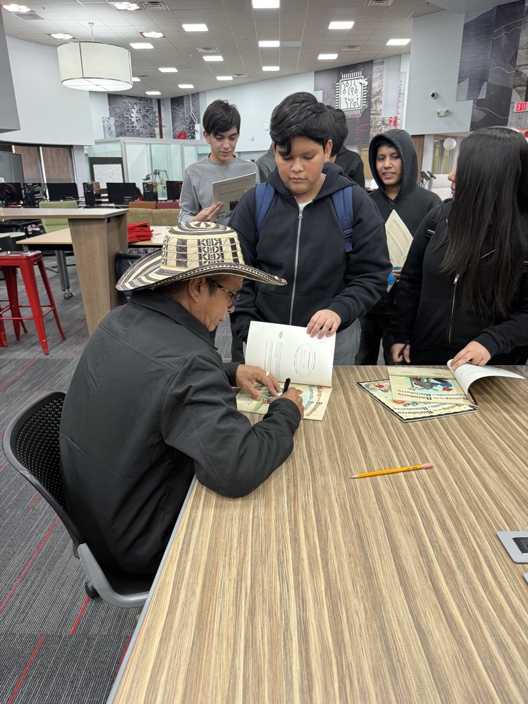 Luis Soriano signing a book