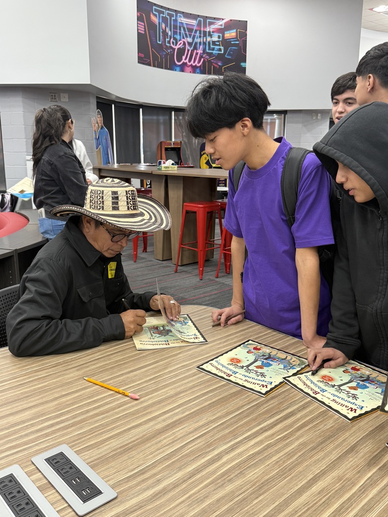 Luis Soriano signing a book