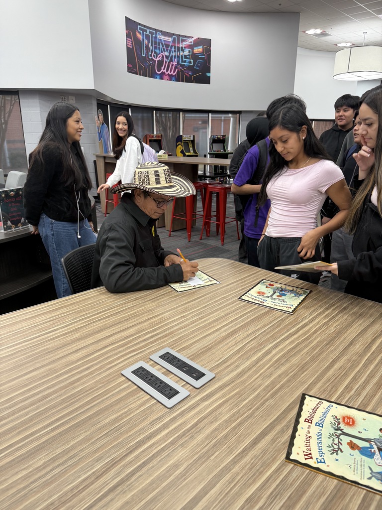 Luis Soriano signing a book