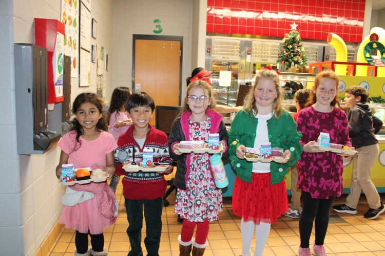 Students holding their lunch plates 