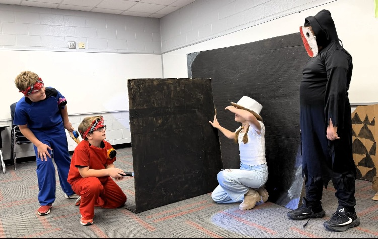 Students acting during their presentation