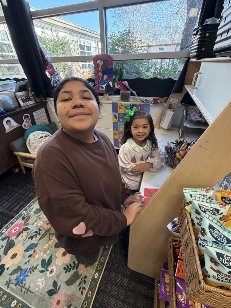 A PreK student with her buddy