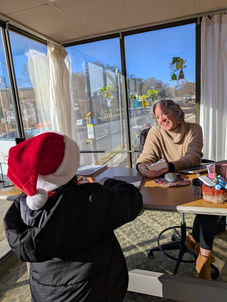 A student delivering a goody bad to a DPS employee 