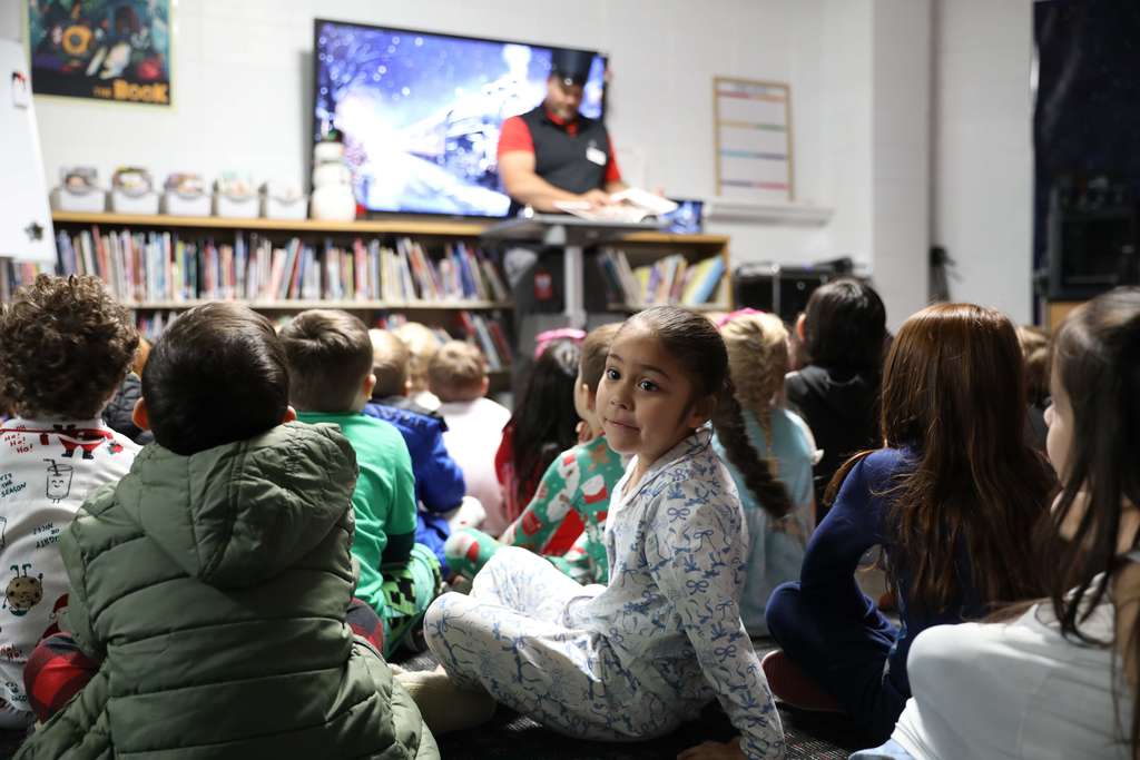 All aboard! 🚂❄️ Yesterday, Deputy Superintendent Nick Sun made a special stop at Westwood School to read "The Polar Express." After presenting their golden tickets, students traveled along the tracks to find the perfect reading spot while Mr. Sun brought the story to life as the Conductor. A magical journey full of imagination and joy!