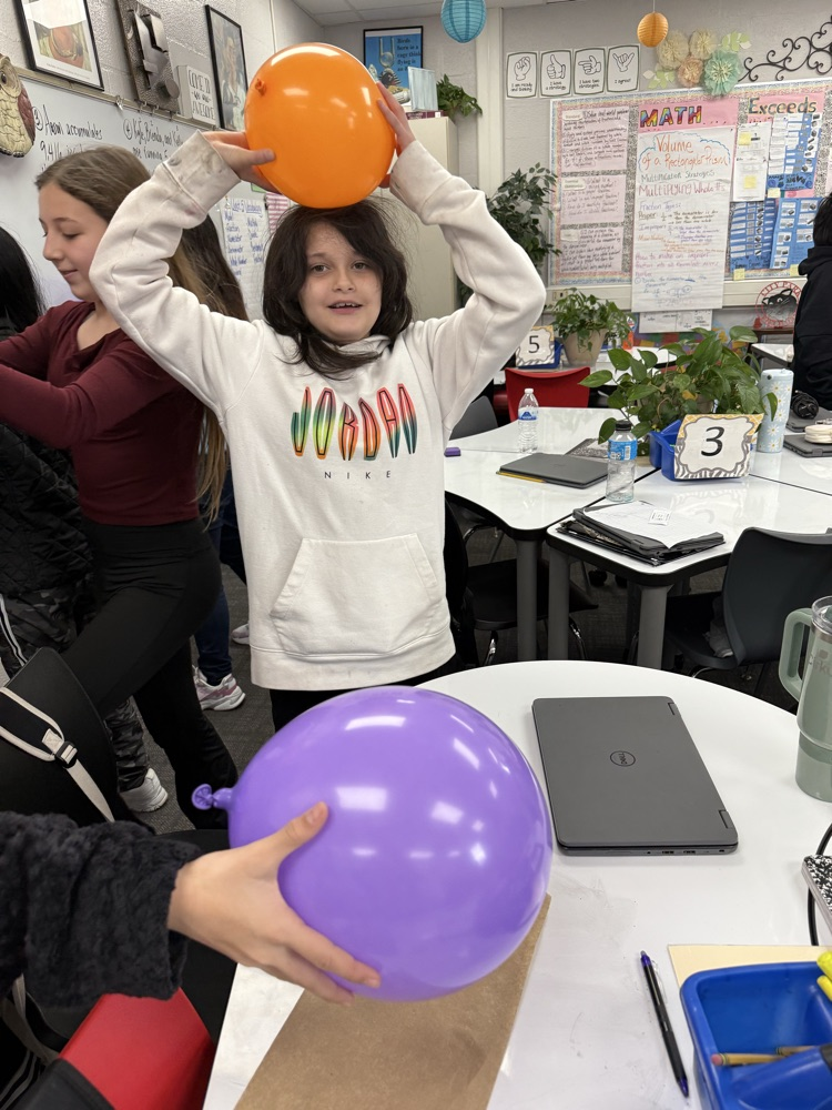 students conduct science experiment