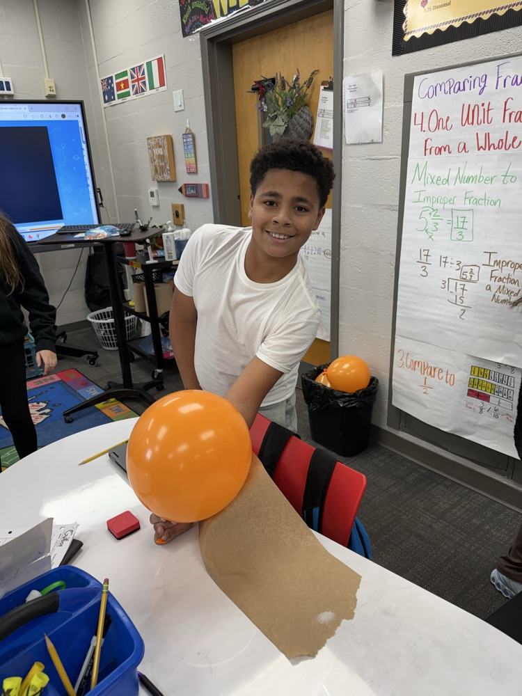 students conduct science experiment