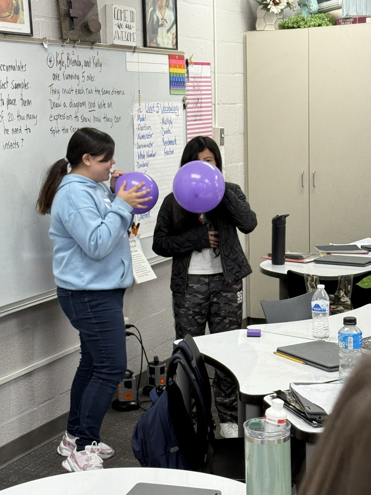students conduct science experiment