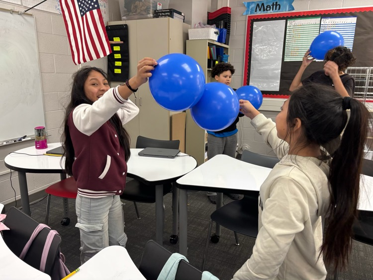 students with science experiment
