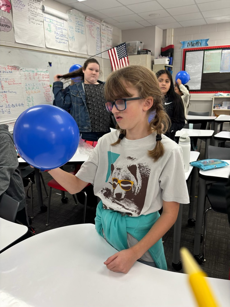 students with science experiment