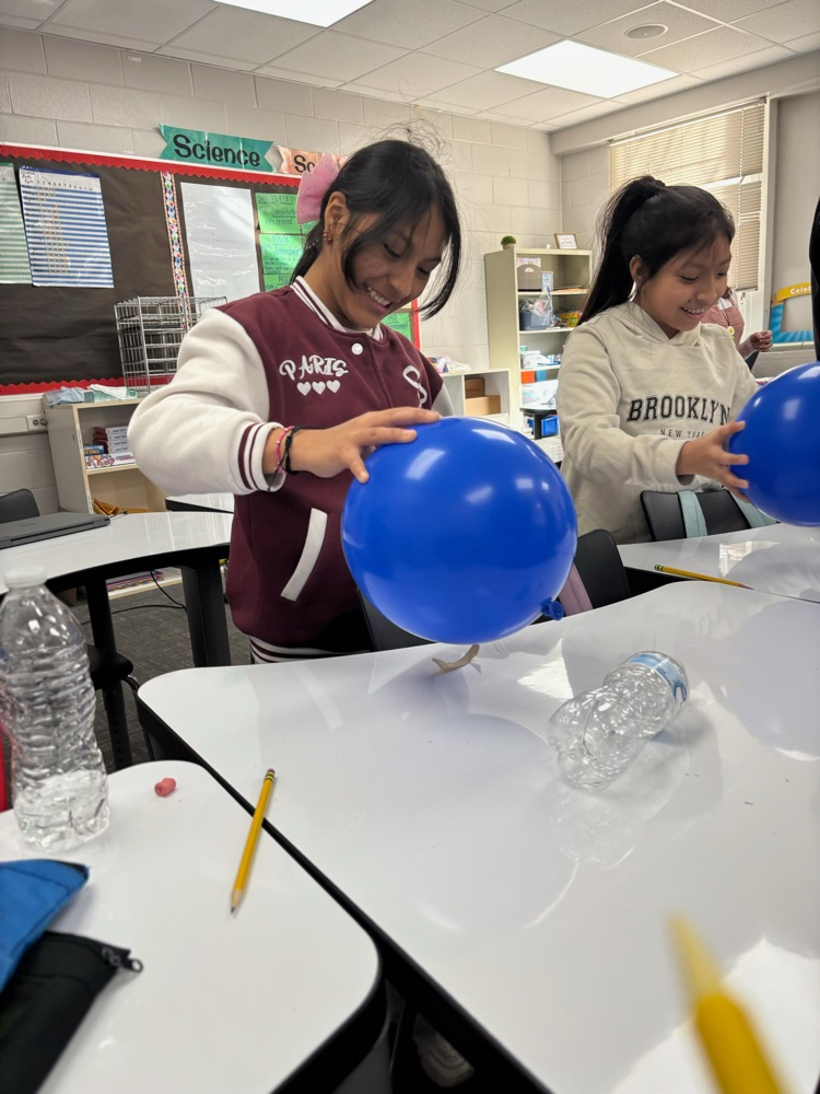 students with science experiment
