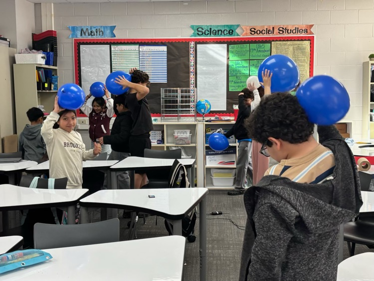 students with science experiment