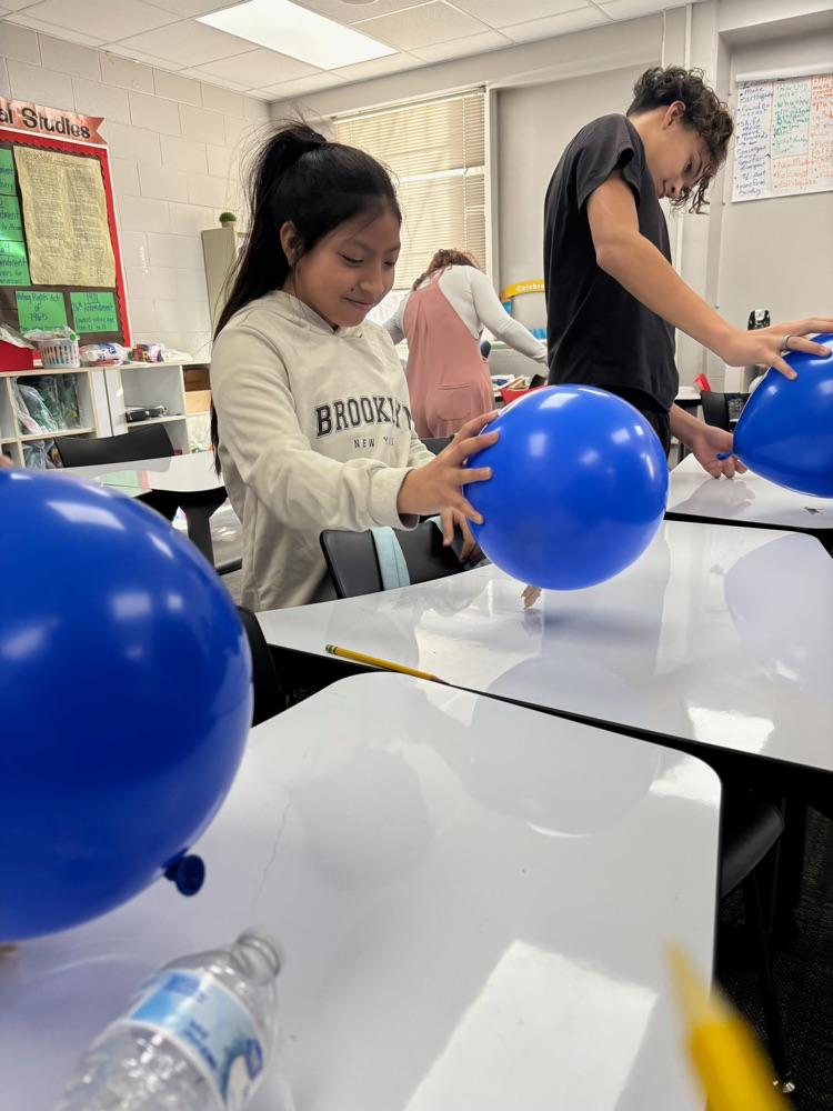 students with science experiment