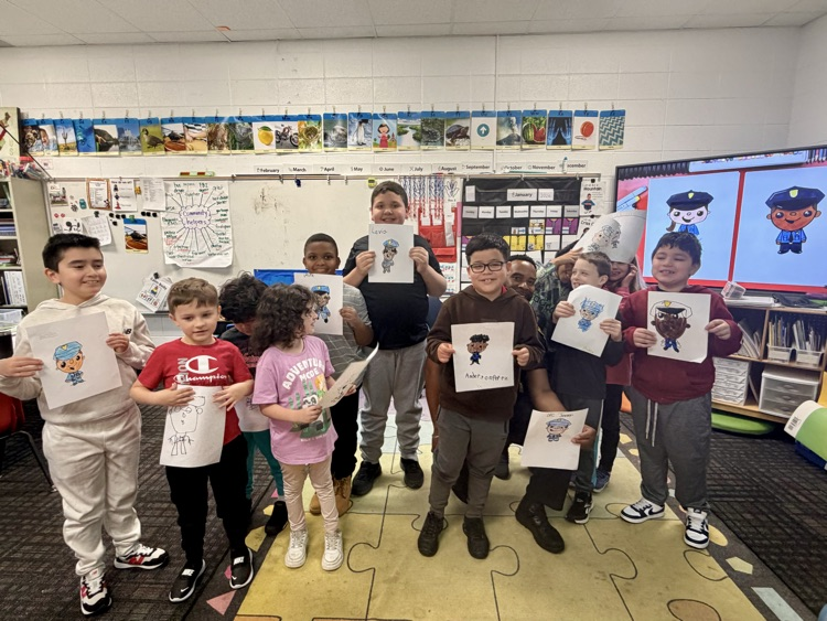 A group picture of the students with their drawing 