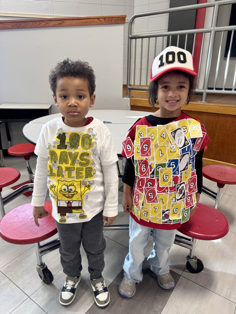 Student with 100 UNO cards on her shirt 