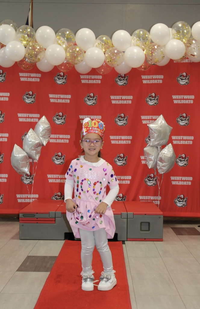 A Student with 100 gems on her dress