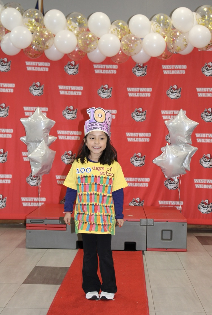 A student with 100 crayons on her shirt 