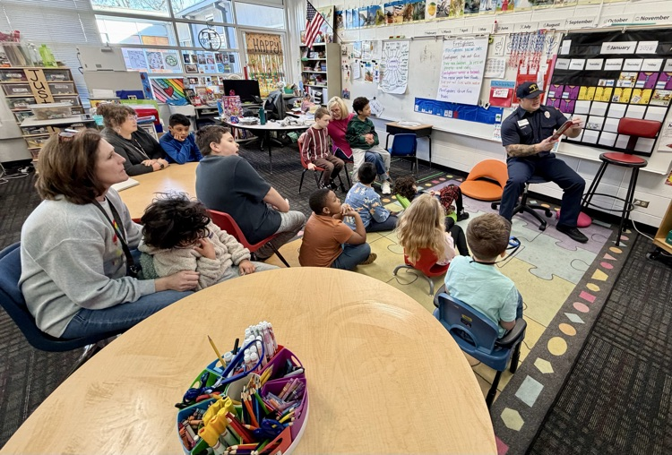 Mr. Shupe reading a book to the class 