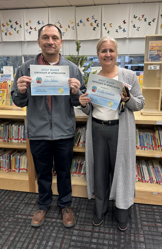 Dr. Shaw and Mrs. Carlson with their guest readers certificate 