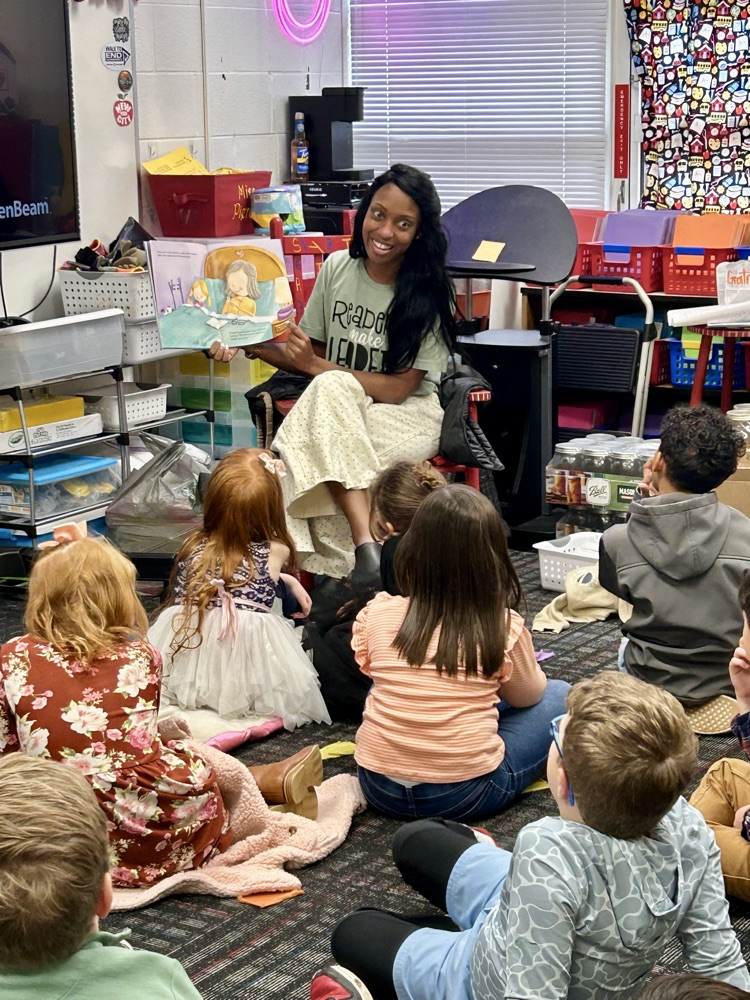 Mrs. Love reading to a class 