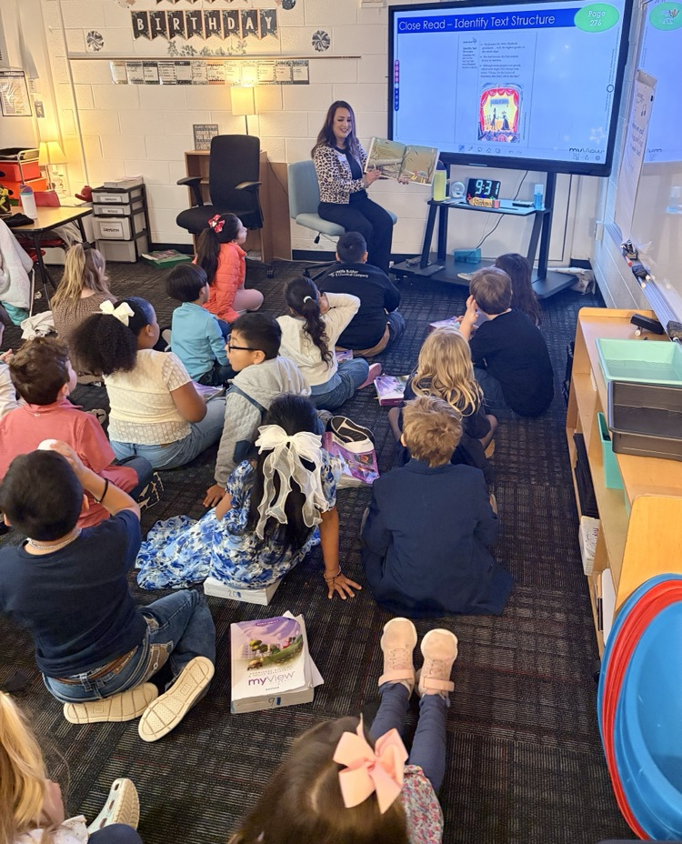 Mrs. Sandoval reading to a class 