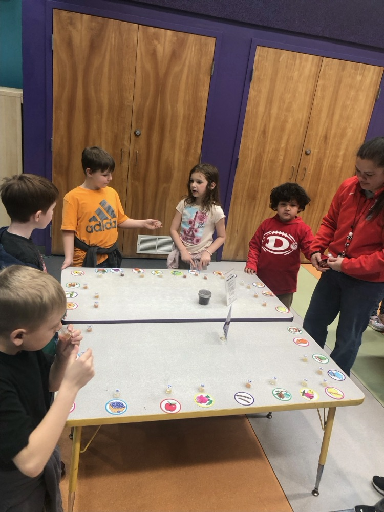 Students playing in a five senses exhibit 