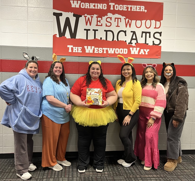 PreK teachers dressing up as Winnie the Poo and friends 