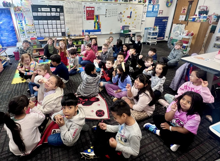 A group picture of students with their peanut food 
