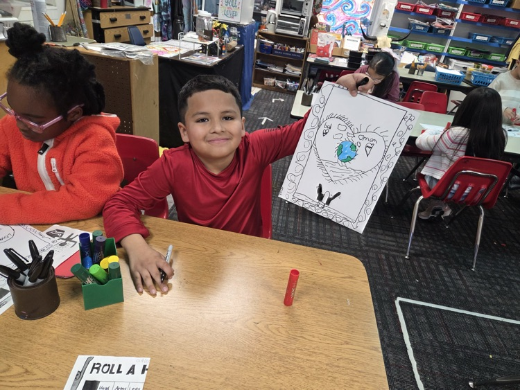 Student showing his heart drawing 
