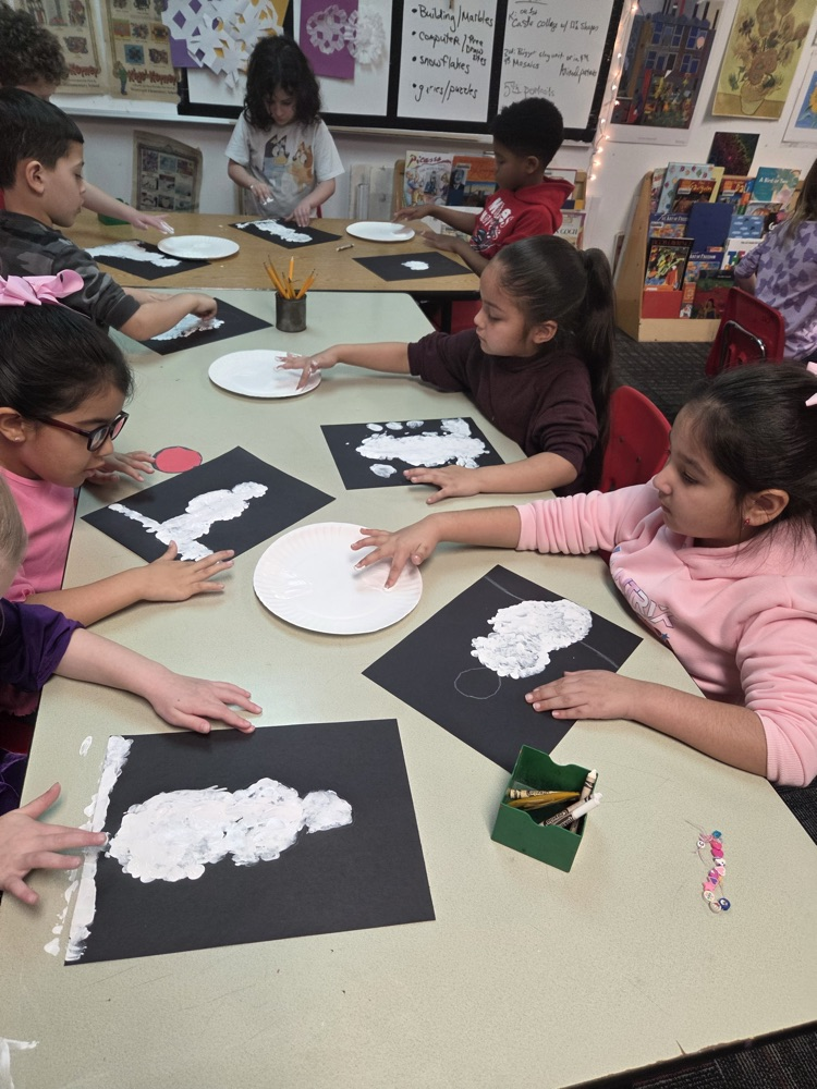 Students painting a snow men 