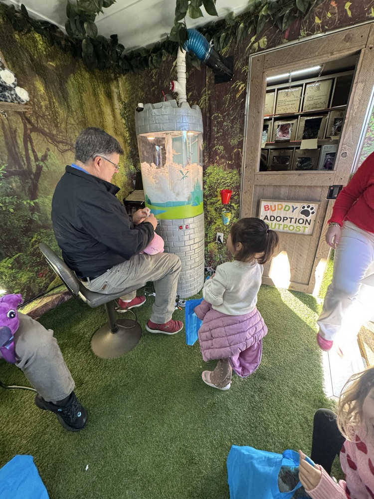 A student making her stuffed animal 