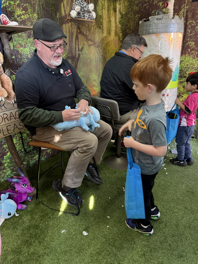A student making his stuffed animal 