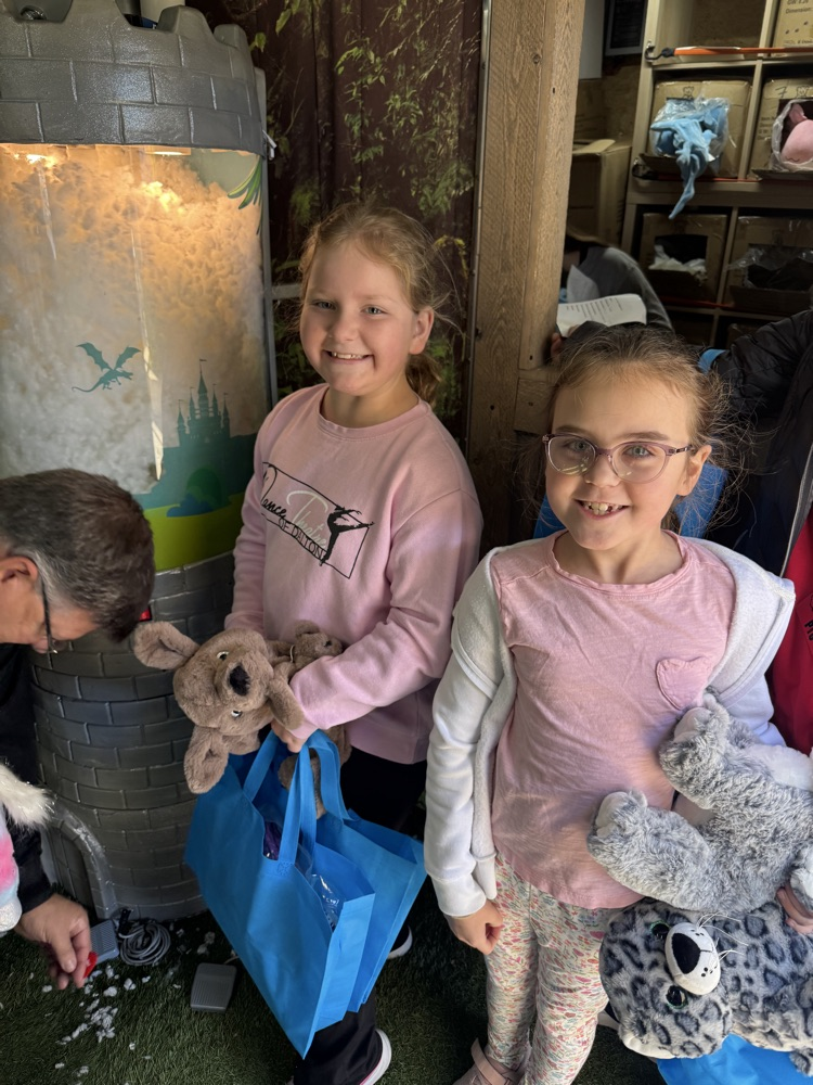 Two girls with their stuffed animal 