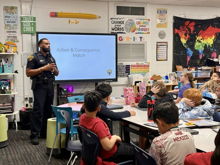 Officer Johnson teaching students about actions and consequences 