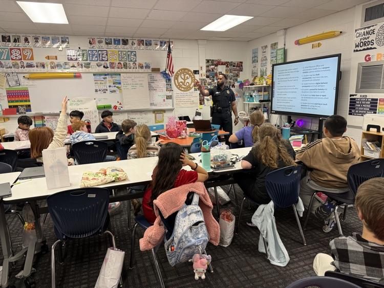 Officer Johnson talking to students 