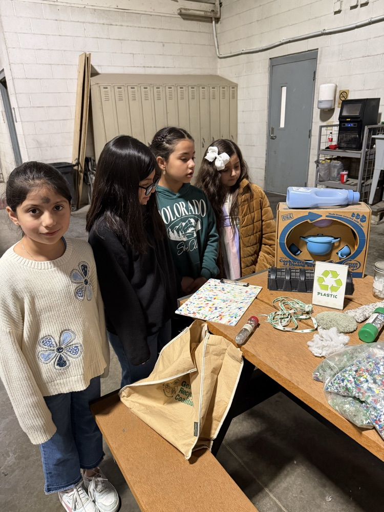 Students learning about recycling items 