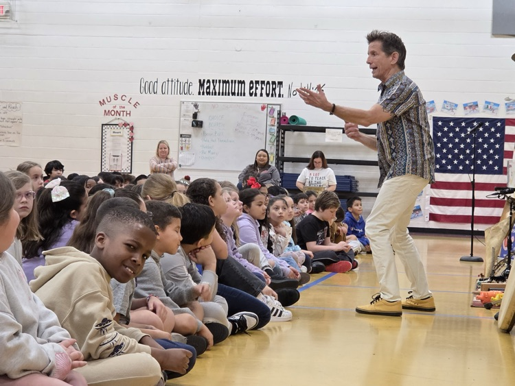 The presenter talking to students about sound 