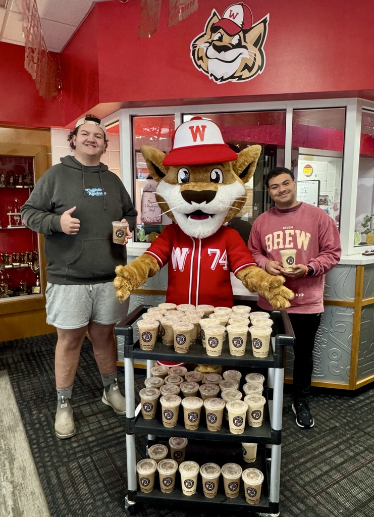 Westie with 7 Brew Coffee employees 