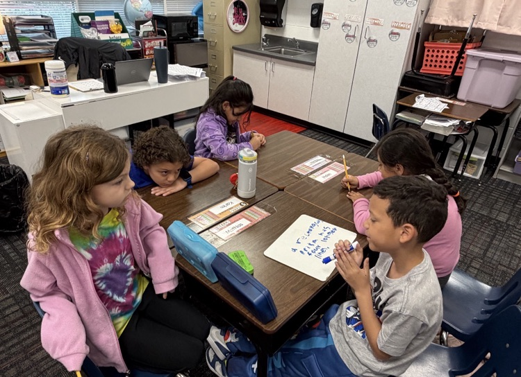 A picture of students working together 