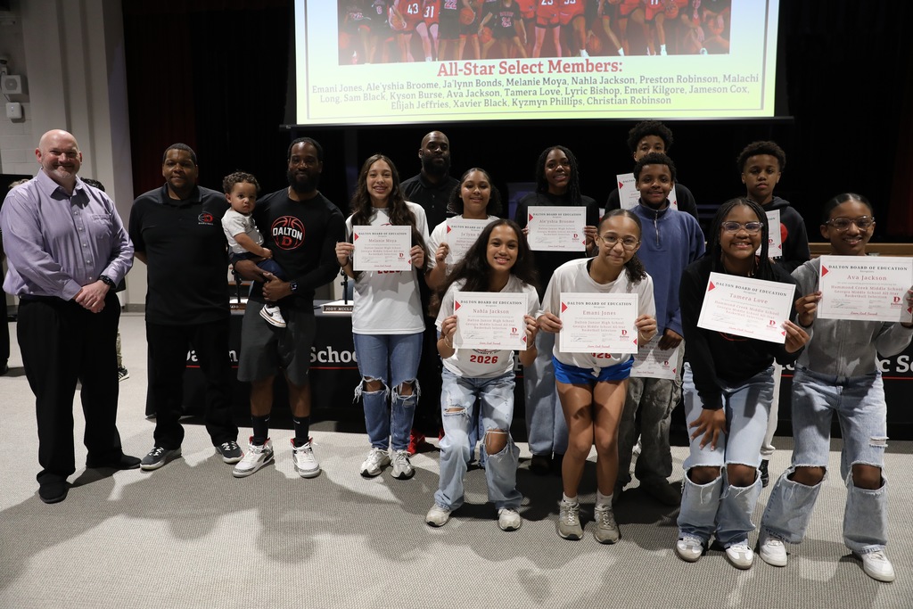 During the March 9 Board of Education meeting, Dalton Public Schools recognized student achievements, staff leadership, and community excellence across the district while also celebrating School Board Appreciation Month with a special presentation honoring the Dalton Board of Education. The Board recognized the Middle School Varsity Basketball Team for earning BGMSAA Runner-up honors, and the Dalton High School Game Day Cheer Team for qualifying for the 2026 State Tournament. The Board also honored Dalton High School senior Angela Ramirez-Ramirez for being named a QuestBridge National College Match Scholar, and student-athletes from Dalton Junior High School and Hammond Creek Middle School who were selected for the Georgia Middle School All-Star Basketball Team. In addition, the Board recognized Jeff Wells for his leadership in guiding all 10 Dalton Public Schools to earn the Ready Georgia Seal of Preparedness. Students from Dalton High School were also honored for their work featured in the Hunter Museum Teen Art Show, including Giselle Nunez, Aaron Augustine, and Sulema Morales, whose artwork earned recognition and awards. The Board also celebrated Dr. Steven Craft for being named a 2025ā2026 Superintendent to Watch by the National School Public Relations Association (NSPRA). The Board congratulates all honorees for their dedication, talent, and commitment to excellence in Dalton Public Schools.