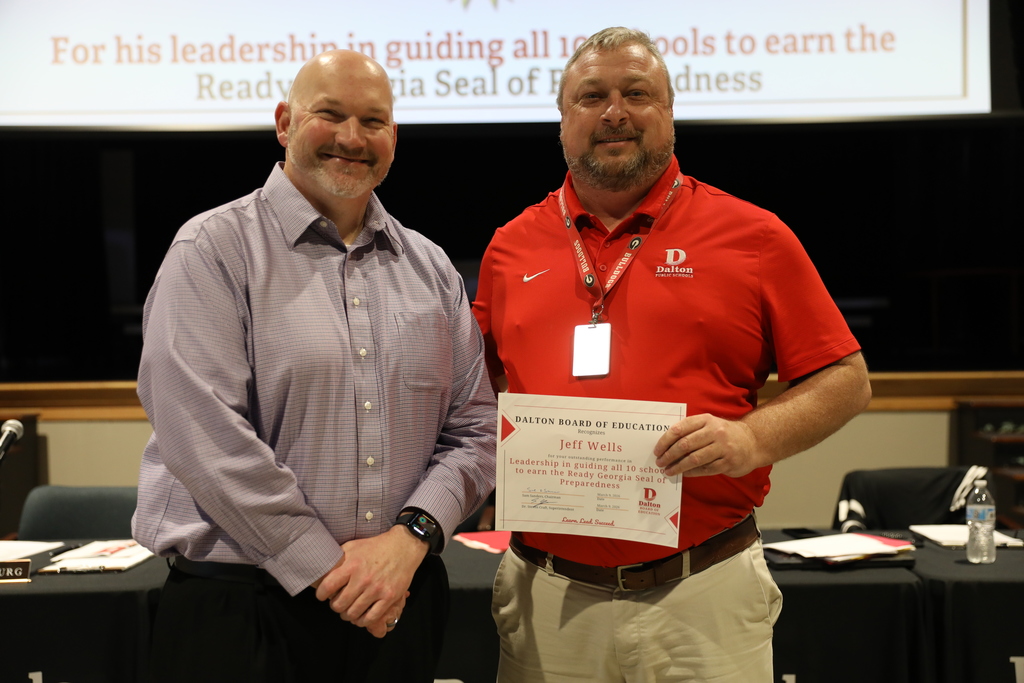 During the March 9 Board of Education meeting, Dalton Public Schools recognized student achievements, staff leadership, and community excellence across the district while also celebrating School Board Appreciation Month with a special presentation honoring the Dalton Board of Education.  The Board recognized the Middle School Varsity Basketball Team for earning BGMSAA Runner-up honors, and the Dalton High School Game Day Cheer Team for qualifying for the 2026 State Tournament. The Board also honored Dalton High School senior Angela Ramirez-Ramirez for being named a QuestBridge National College Match Scholar, and student-athletes from Dalton Junior High School and Hammond Creek Middle School who were selected for the Georgia Middle School All-Star Basketball Team.  In addition, the Board recognized Jeff Wells for his leadership in guiding all 10 Dalton Public Schools to earn the Ready Georgia Seal of Preparedness. Students from Dalton High School were also honored for their work featured in the Hunter Museum Teen Art Show, including Giselle Nunez, Aaron Augustine, and Sulema Morales, whose artwork earned recognition and awards.  The Board also celebrated Dr. Steven Craft for being named a 2025–2026 Superintendent to Watch by the National School Public Relations Association (NSPRA).  The Board congratulates all honorees for their dedication, talent, and commitment to excellence in Dalton Public Schools.