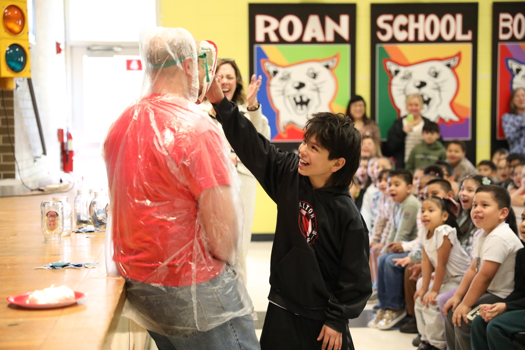 Happy Pi(e) Day! 🎉🥧 Students at Roan School had a blast celebrating Pi Day with a fun (and messy!) fundraiser. After voting for a staff member to receive a pie in the face, lucky students were drawn to do the honors. It was a sweet way to celebrate math and support a great cause!