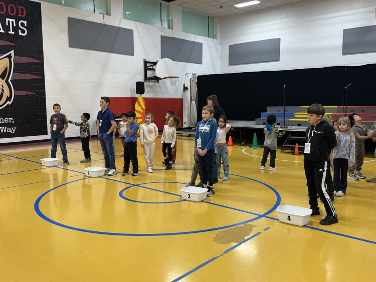 Students helping during PE class 