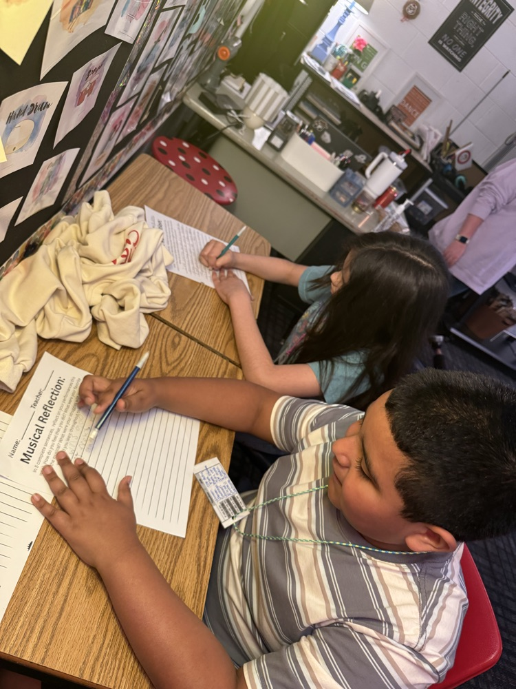 Students helping music teacher 